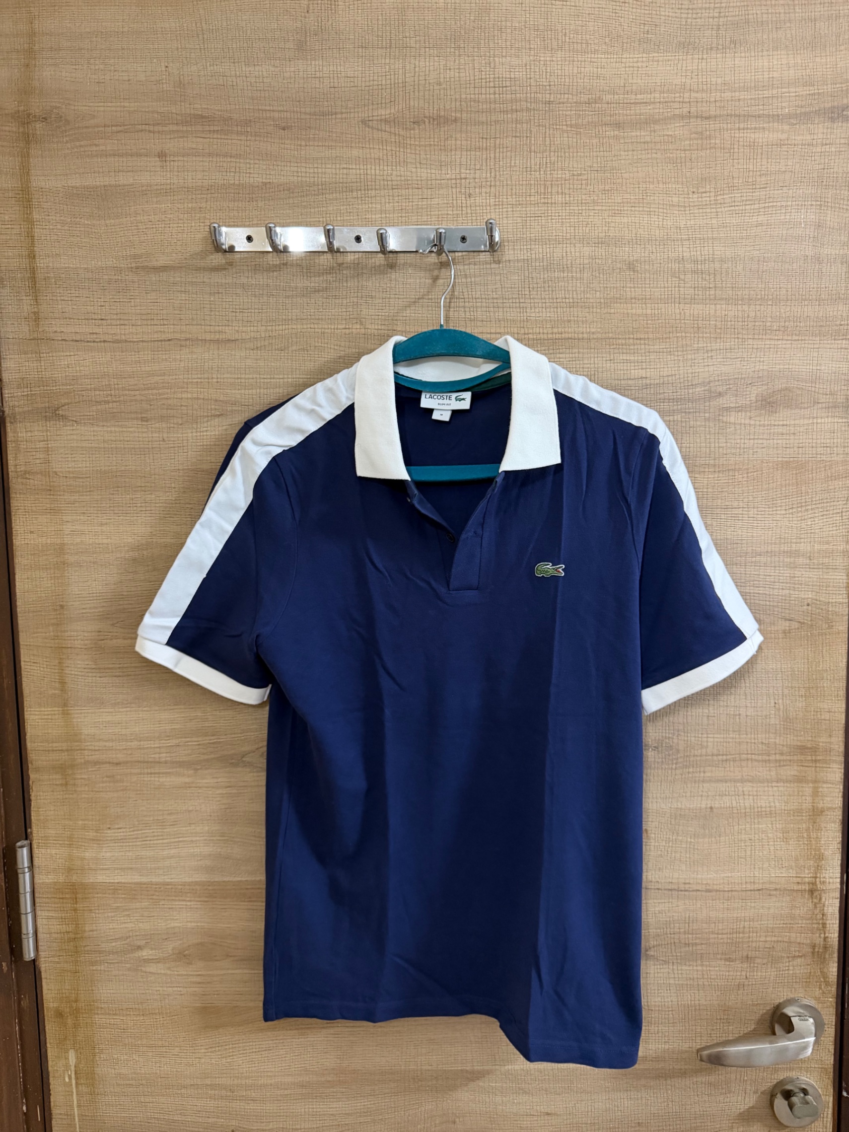 Lacoste NAVY BLUE POLO TSHIRT — pre-loved Tops on Slayyitt