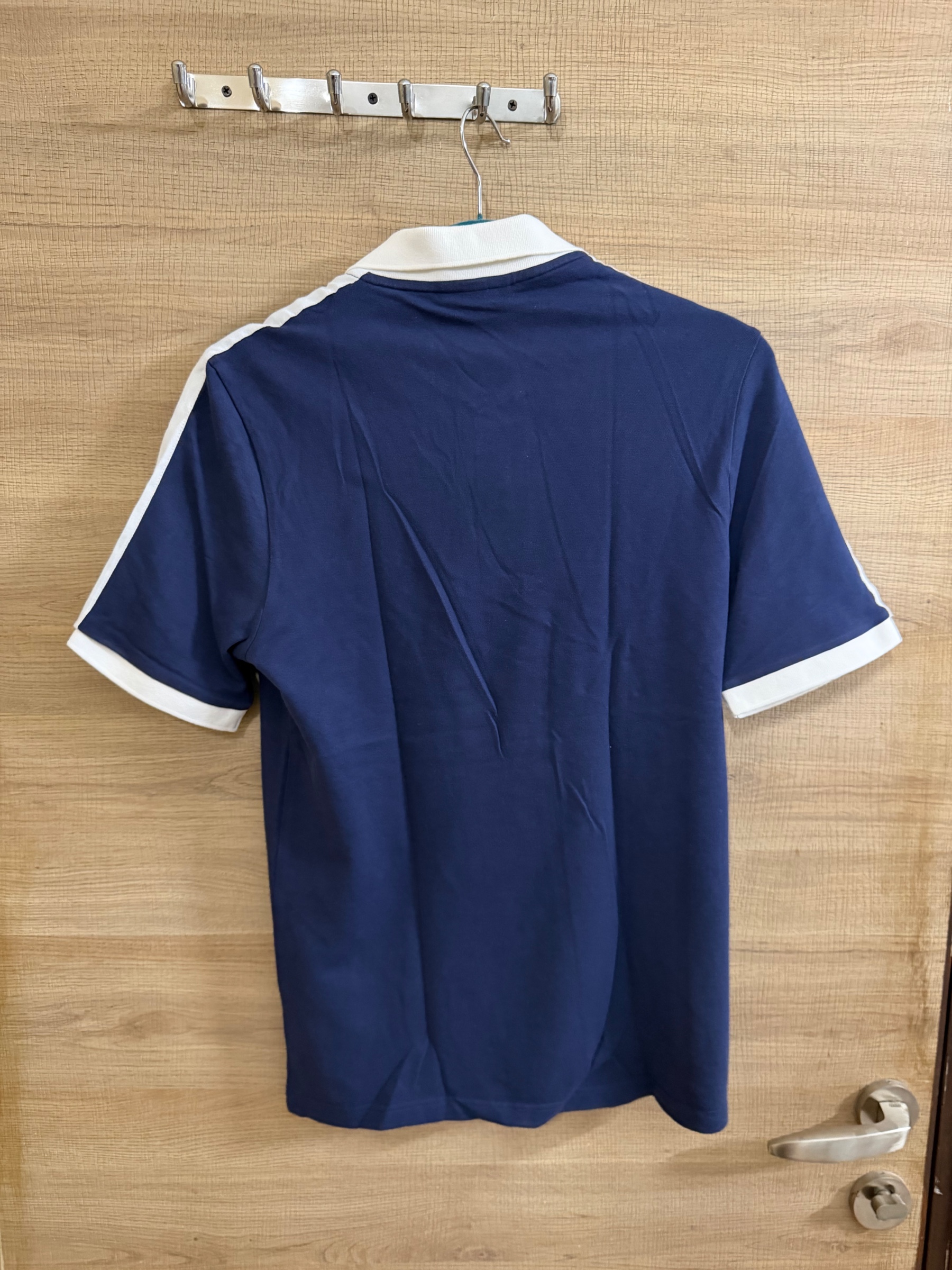 Lacoste NAVY BLUE POLO TSHIRT — pre-loved Tops on Slayyitt