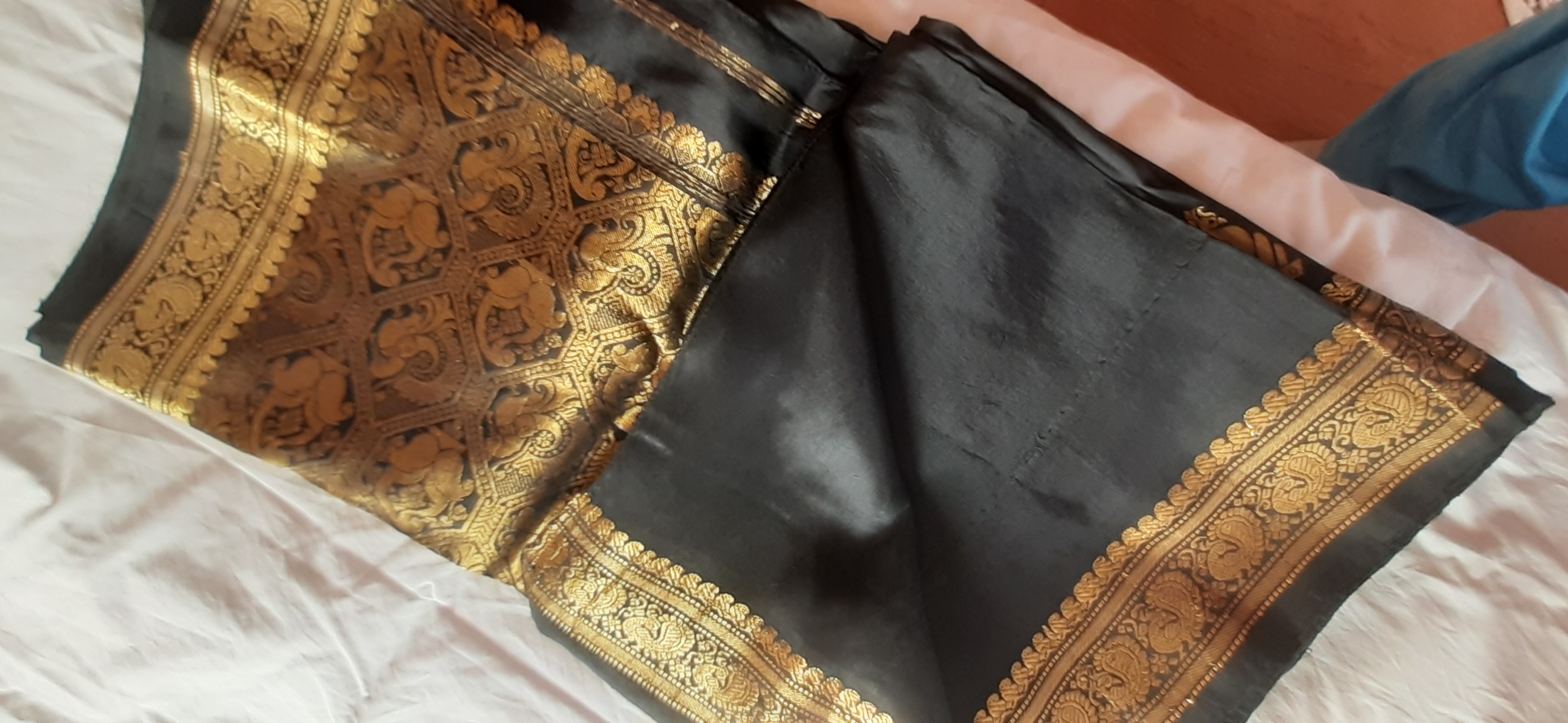 Black saree with gold embossed motifs and border — pre-loved Ethnic Wear on Slayyitt