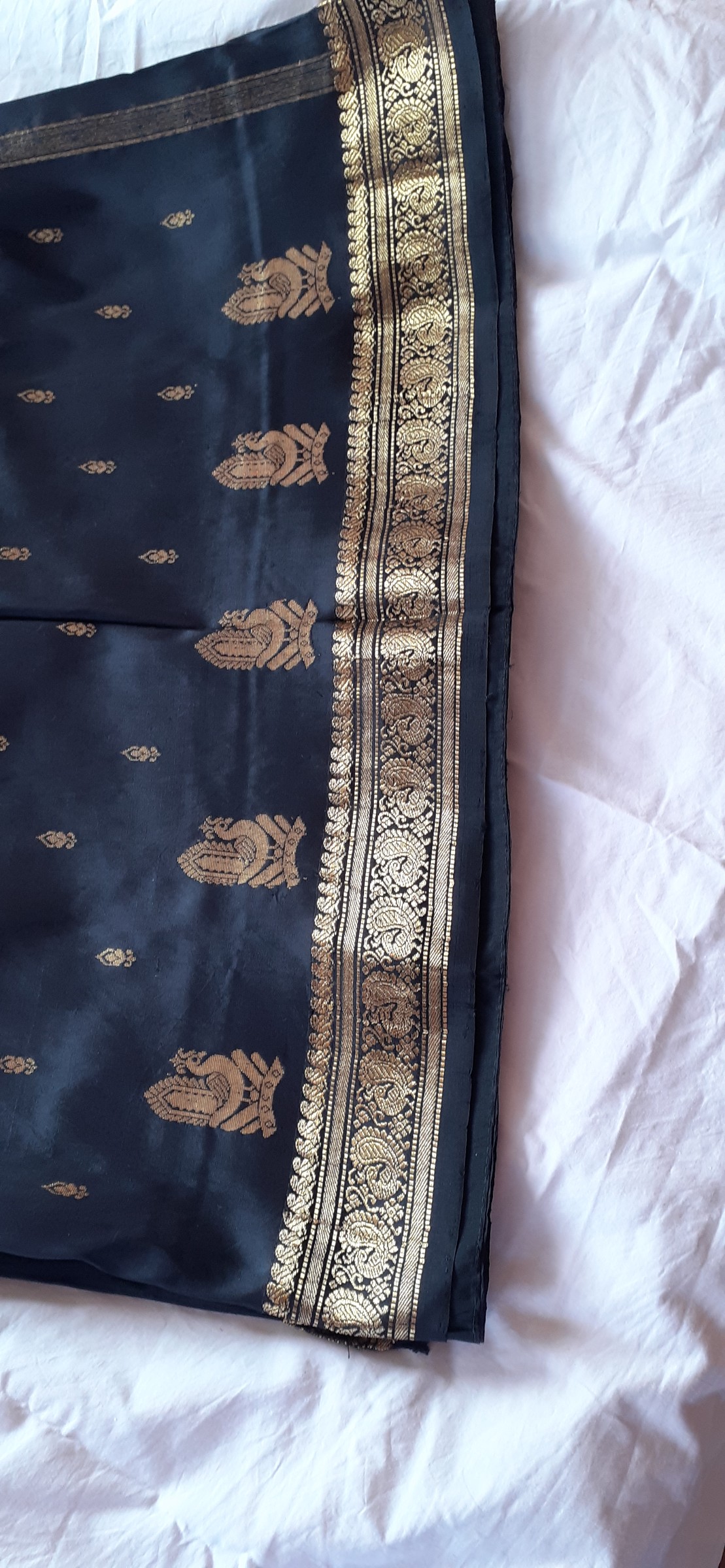 Black saree with gold embossed motifs and border — pre-loved Ethnic Wear on Slayyitt