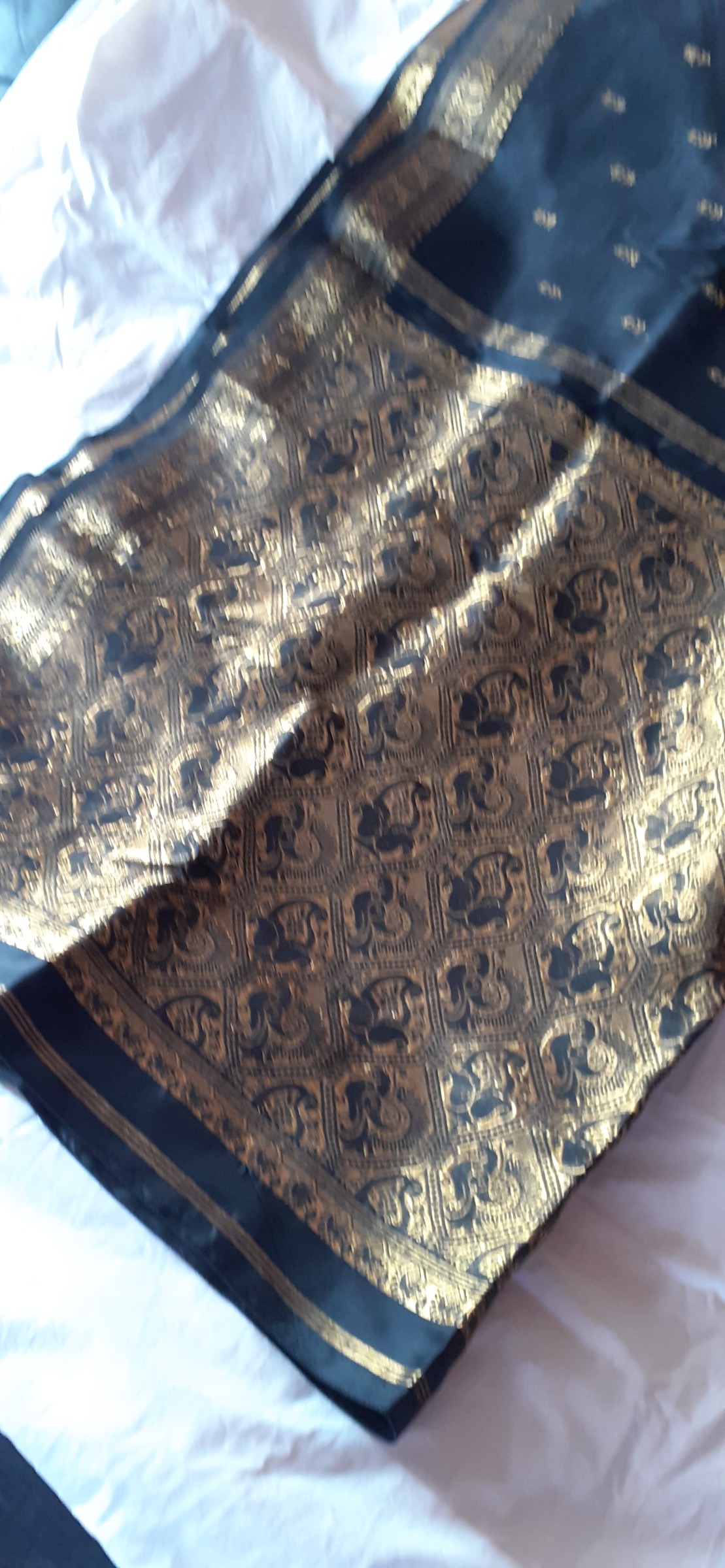 Black saree with gold embossed motifs and border — pre-loved Ethnic Wear on Slayyitt